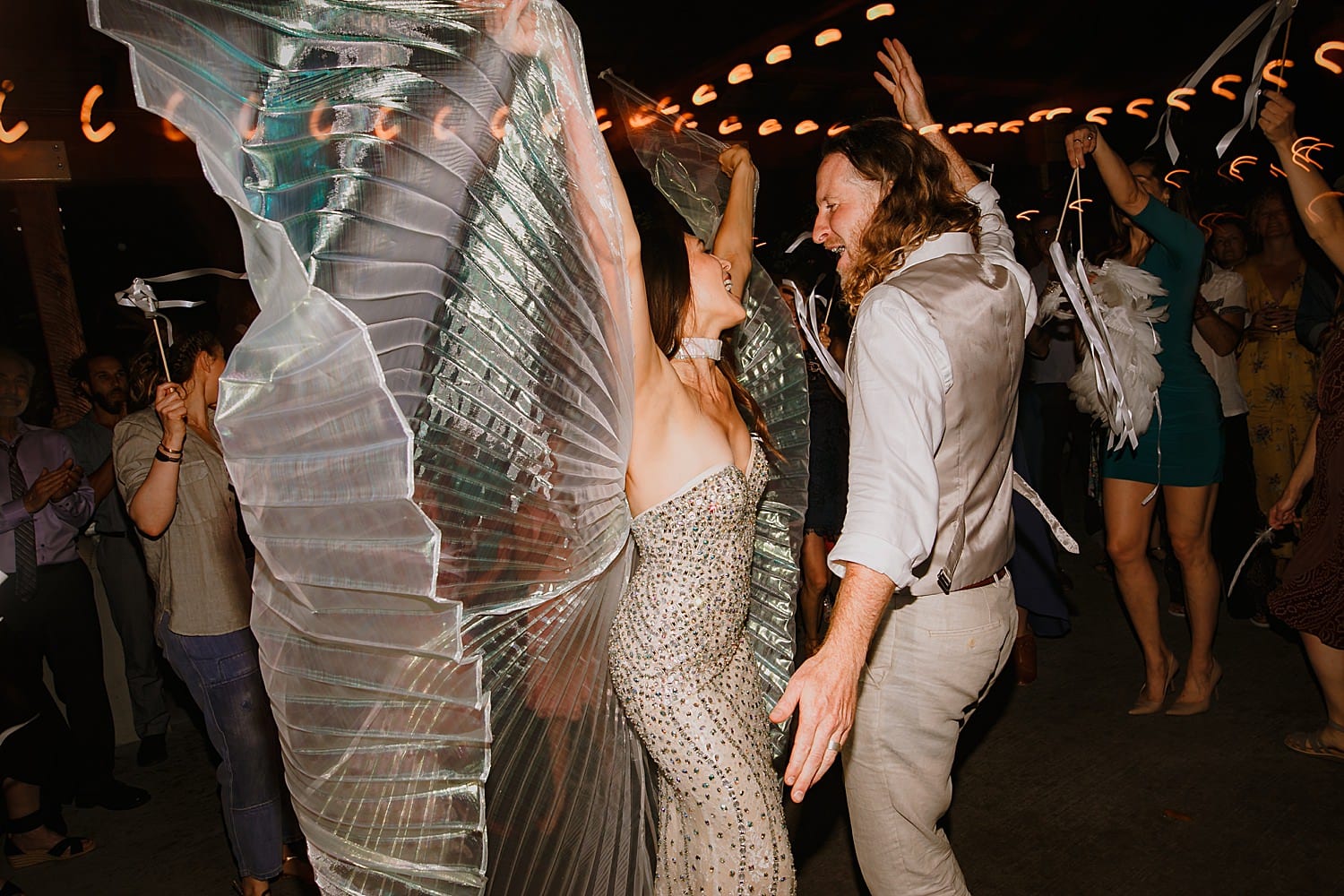 A bride and groom dancing at their Bridal Veil Lakes wedding reception.