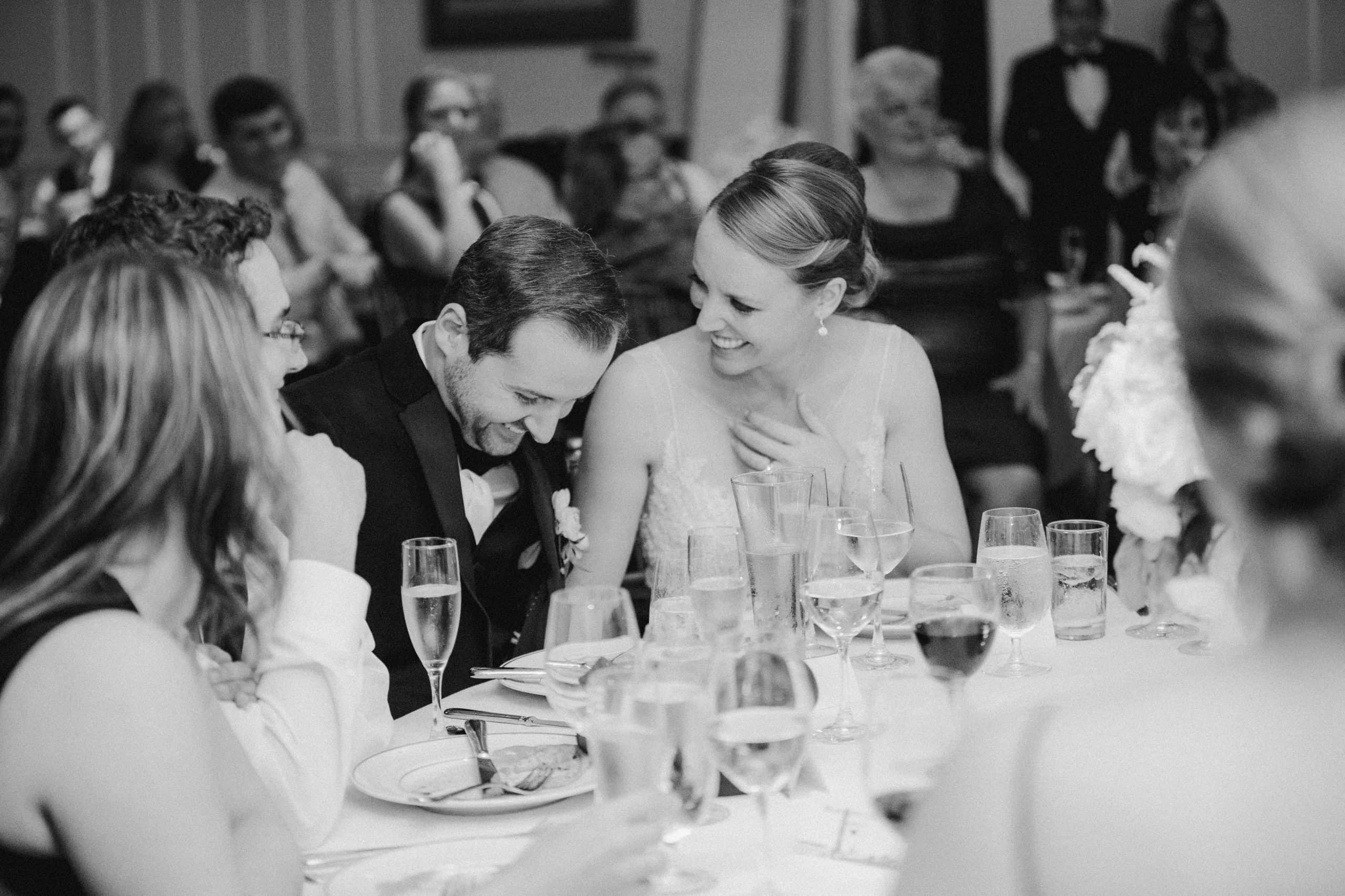 A bride and groom share a sweet moment during their Waverley Country Club wedding reception.
