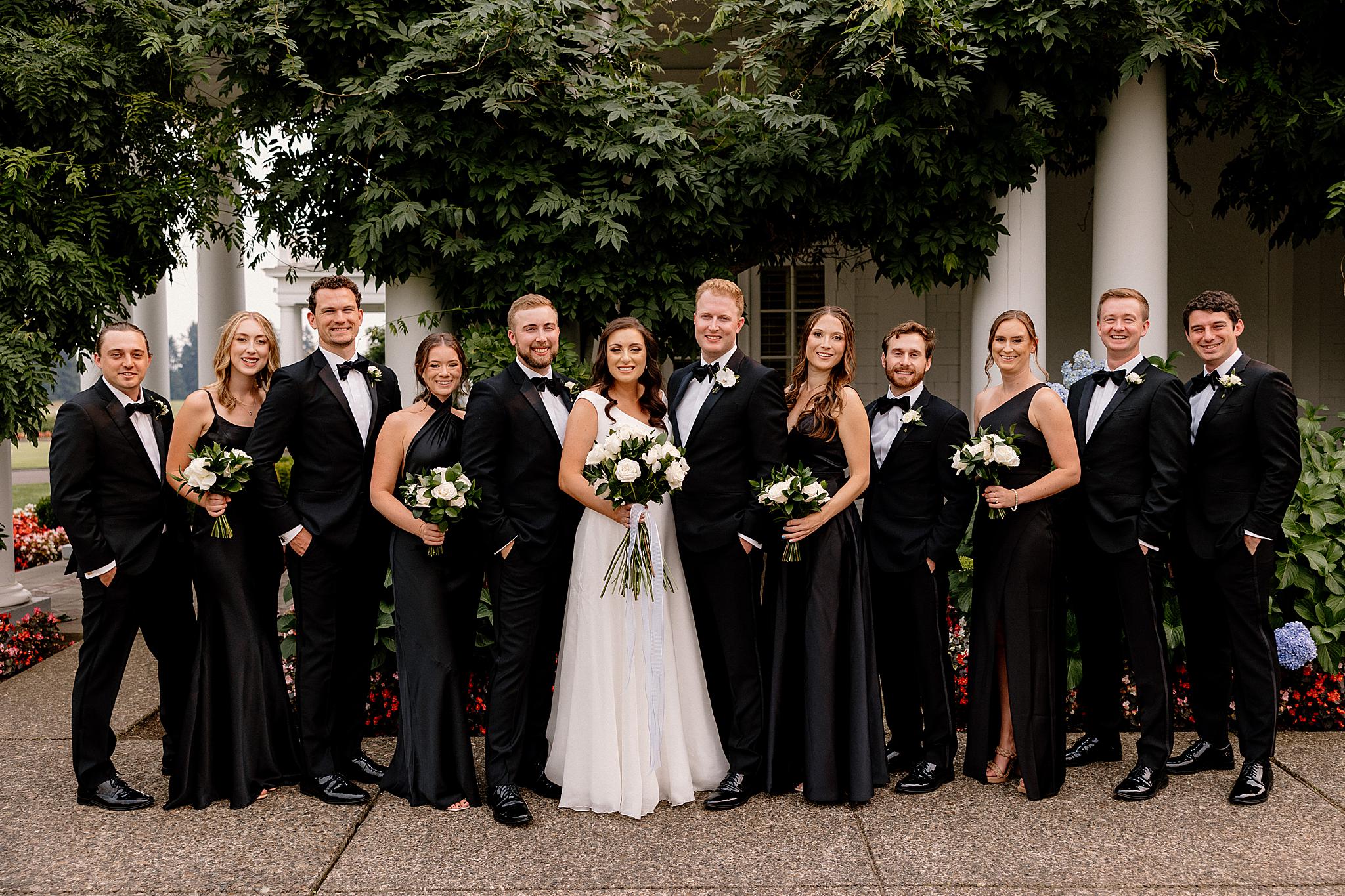A wedding party smiles for the camera at Waverley Country Club. 