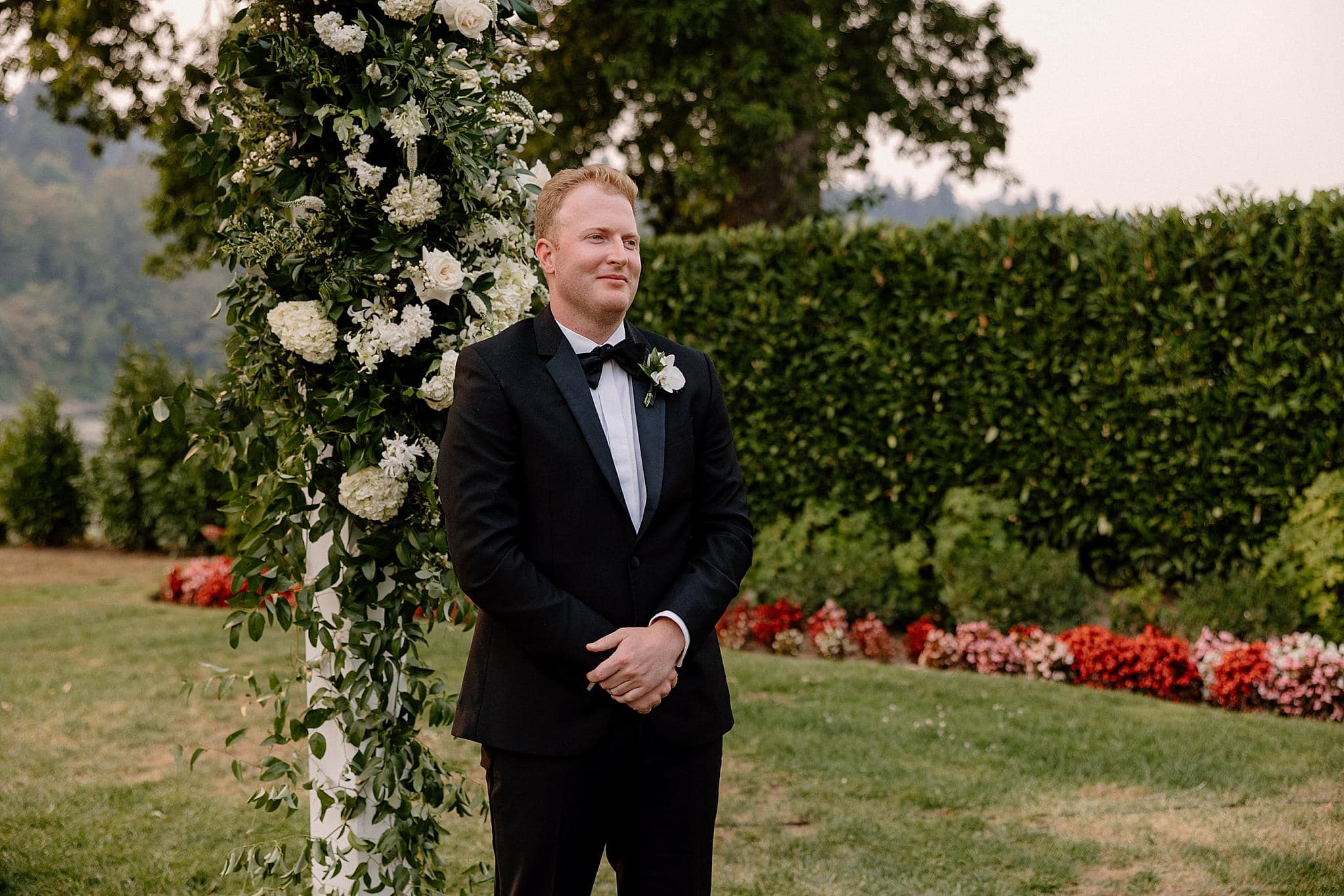 A groom awaits his bride in Lake Oswego, Oregon. 