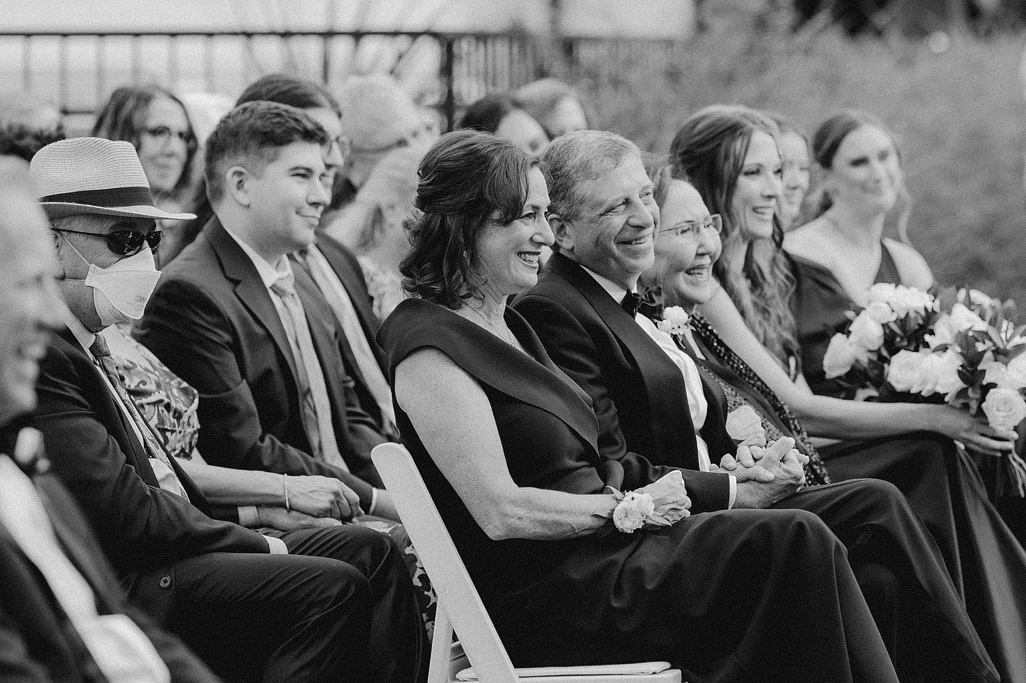 Parents laughing at a wedding ceremony in Lake Oswego, Oregon. 