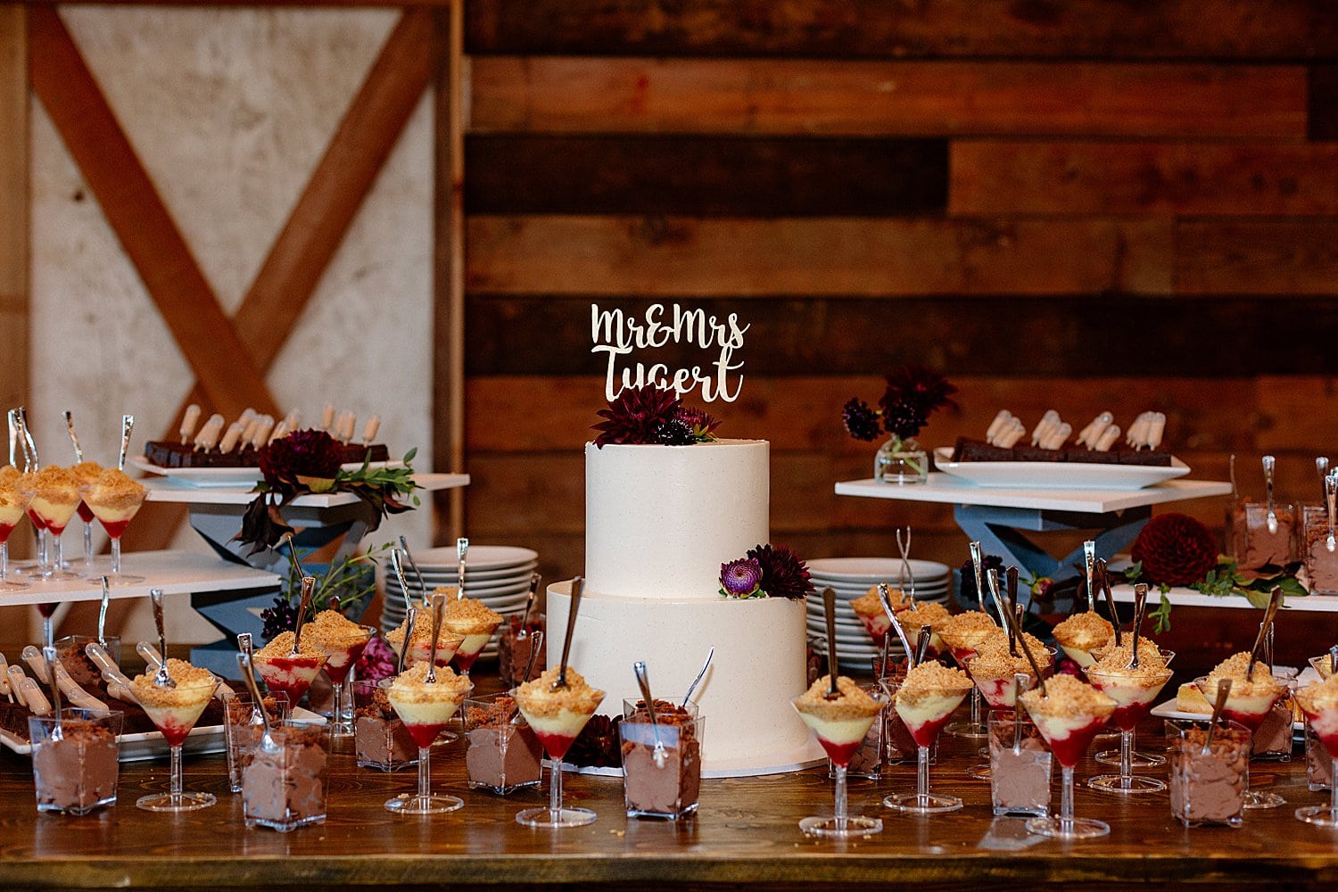 A wedding cake and dessert display at Abbey Road Farm.