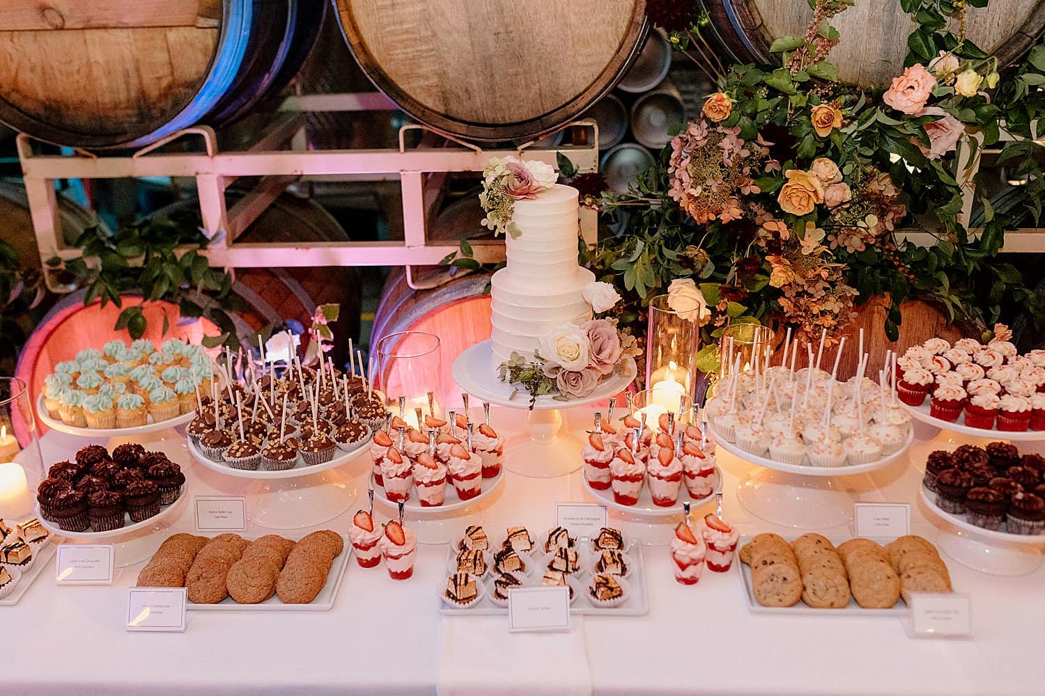 A wedding cake and dessert display at Coopers Hall in Portland.