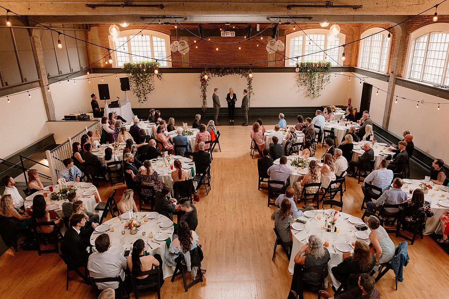 An ariel view of The Evergreen in Portland from the loft space during an indoor wedding ceremony.