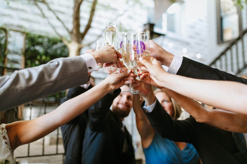 Guests toasting at Opal 28 after an indoor Portland wedding ceremony.
