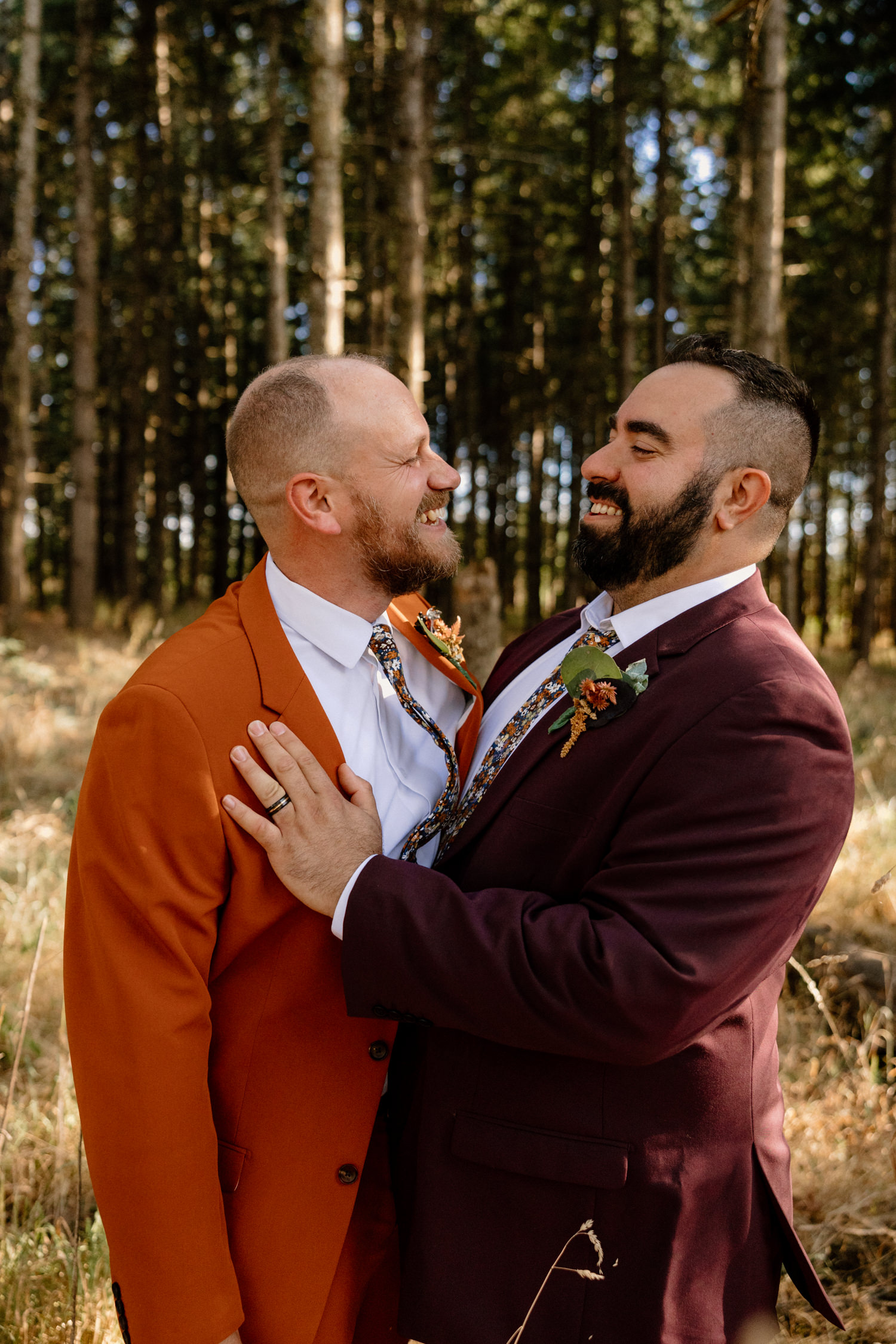 A gay couple taking wedding portraits at the Oregon Garden. 