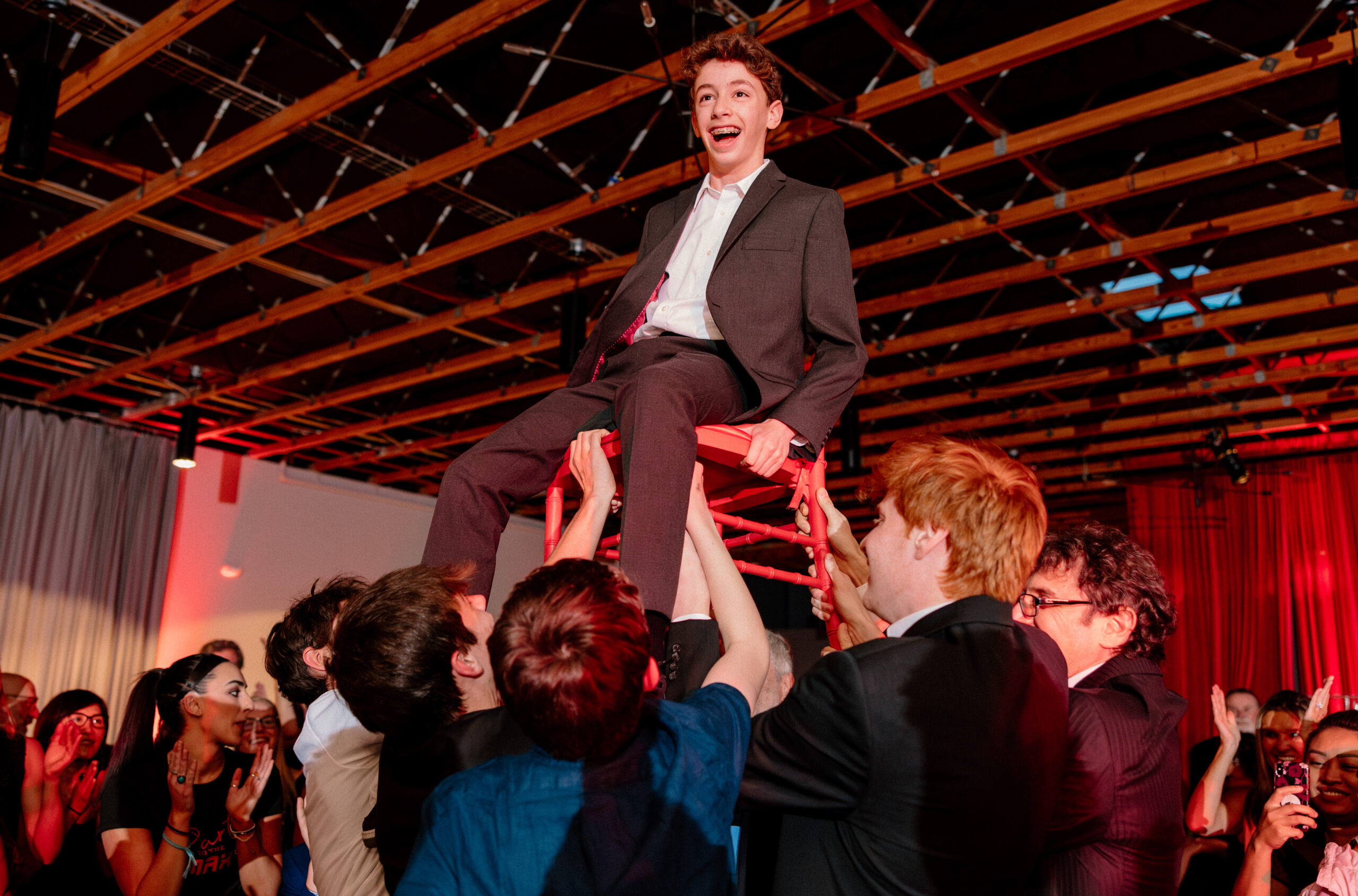A child doing the hora at their bar mitzvah at the Loft on 8th in Portland.