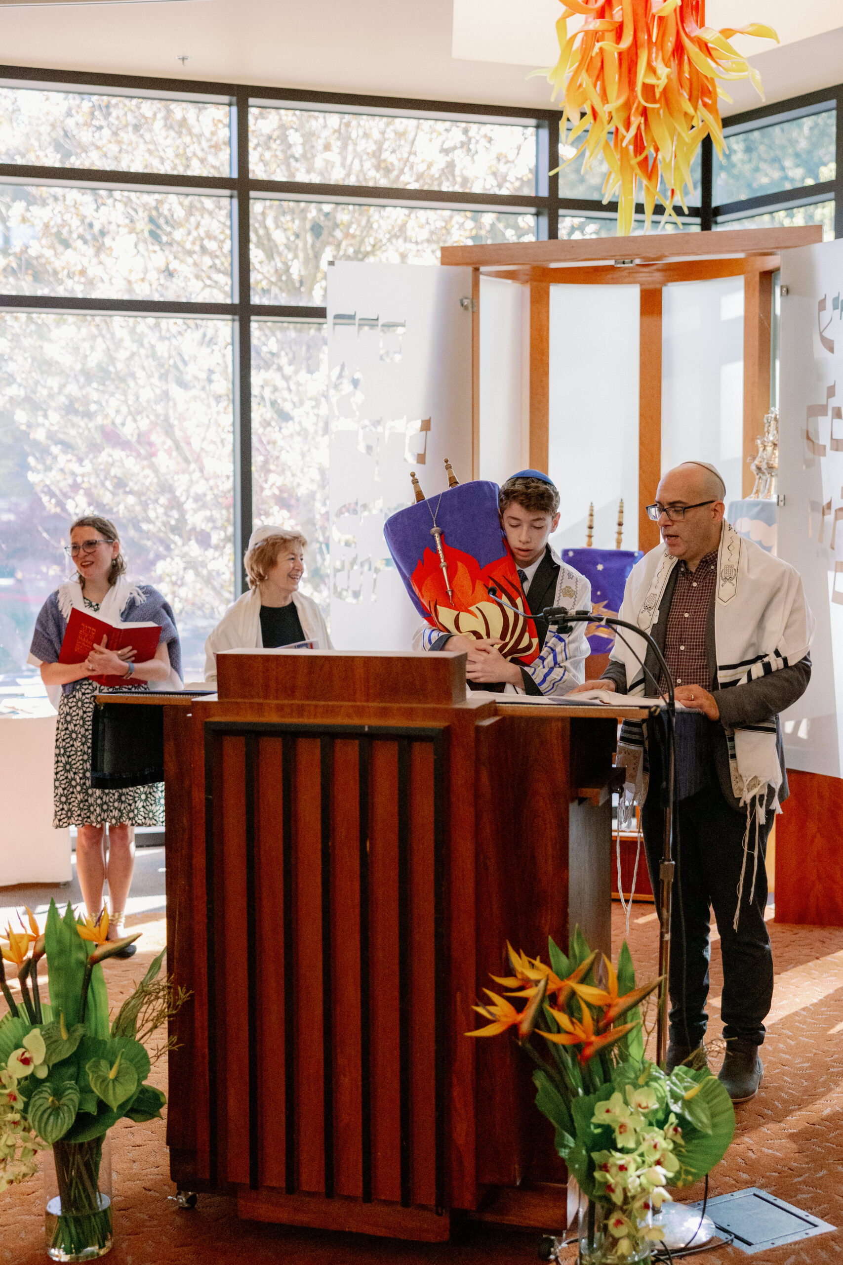 A child reads from the torah during his bar mitzvah service at Congregation Nevah Shalom.