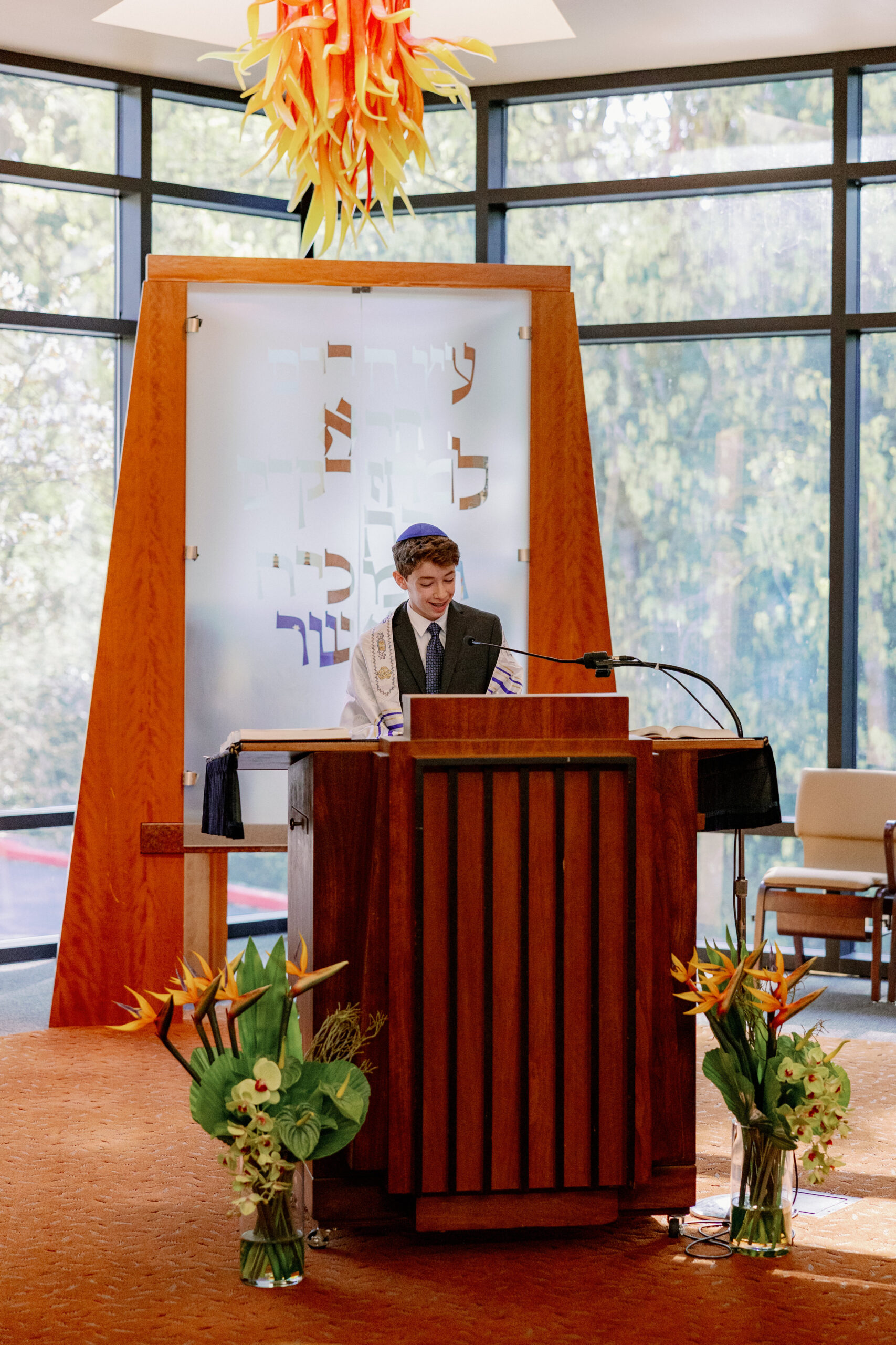 A child reading from the torah during his bar mitzvah service at Congregation Nevah Shalom.